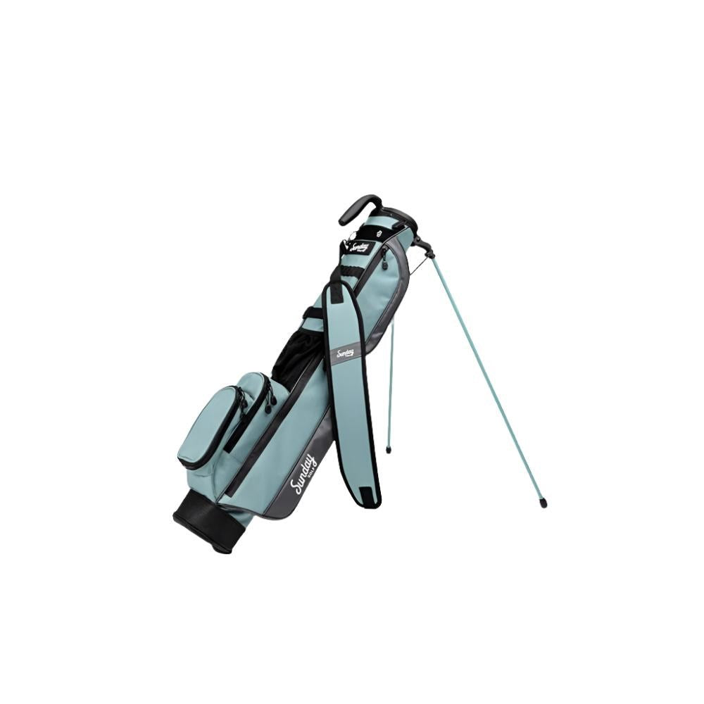 A blue and black golf bag with a stand mechanism deployed, set against a white background.