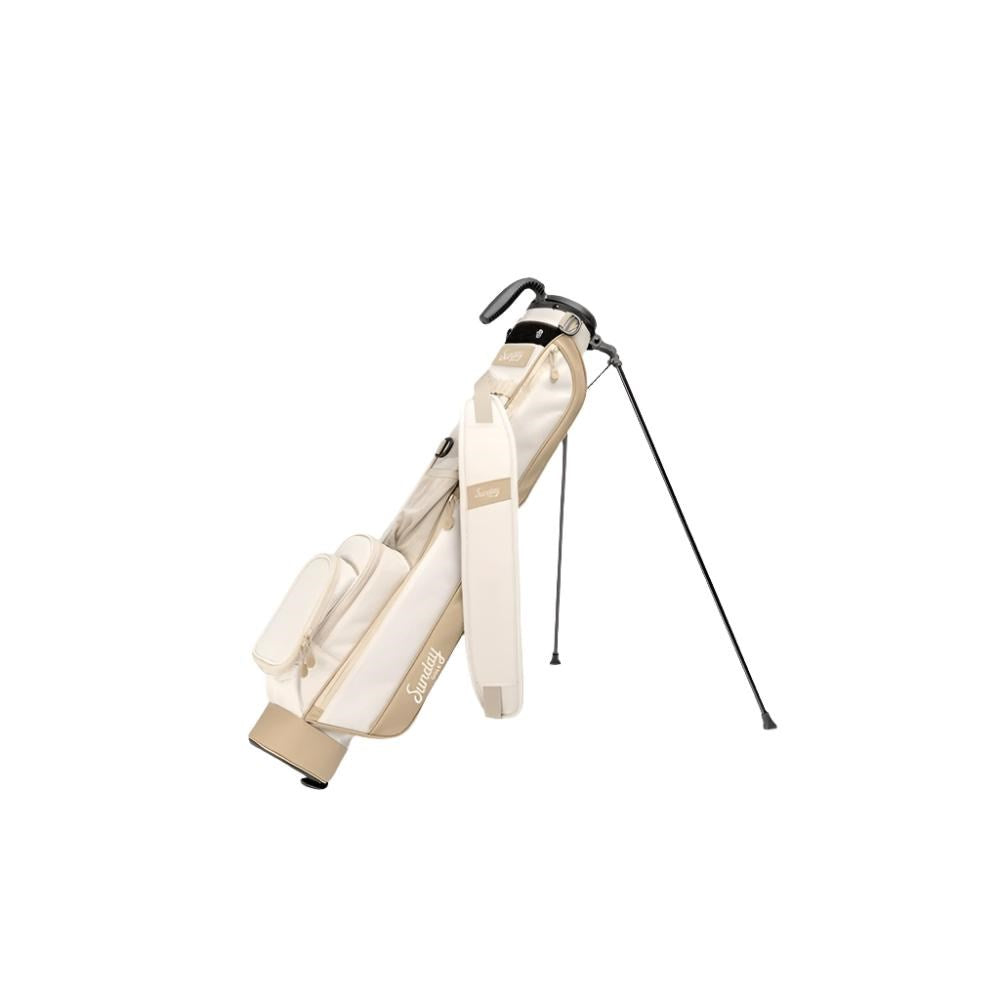 A beige golf bag with a stand, featuring multiple pockets and a shoulder strap.
