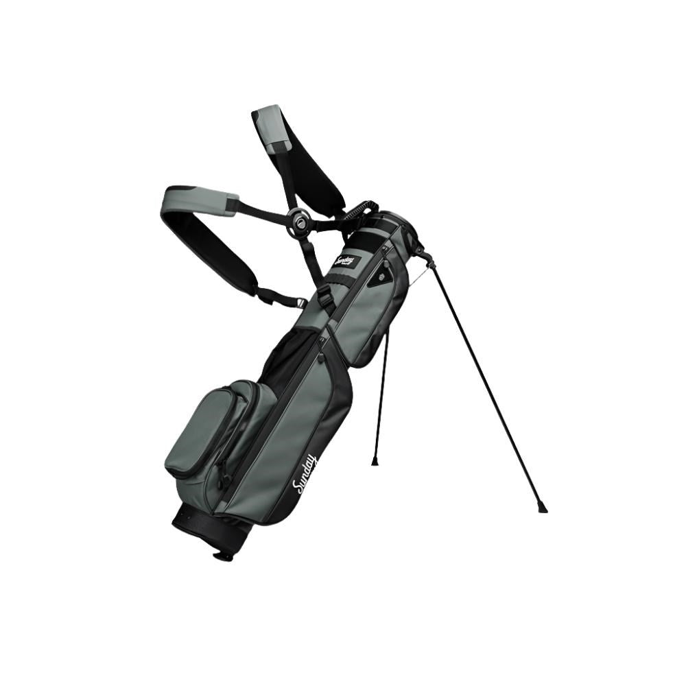 A black golf bag with a stand system, multiple pockets, and branding on the side.