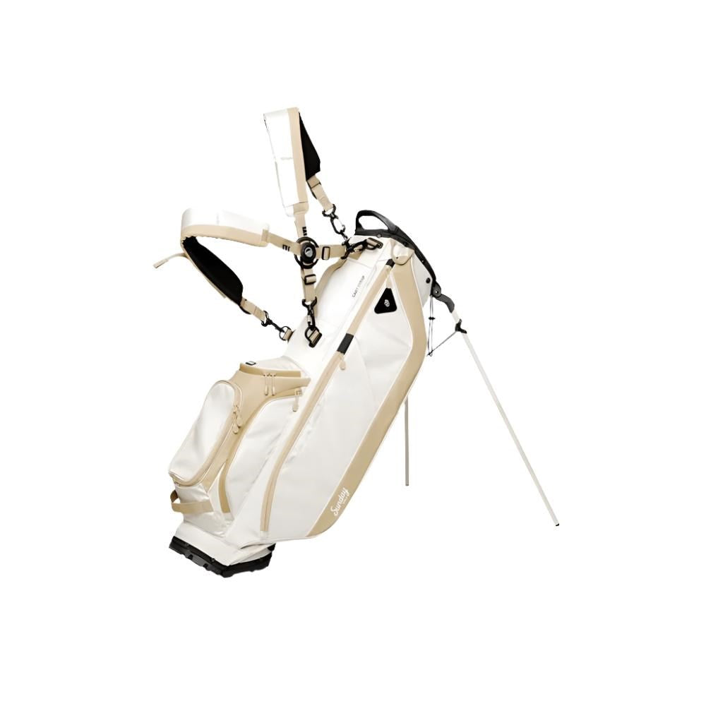 A full-size stand golf bag in beige and white, featuring multiple pockets, a built-in carry handle, and a backpack-style strap system.