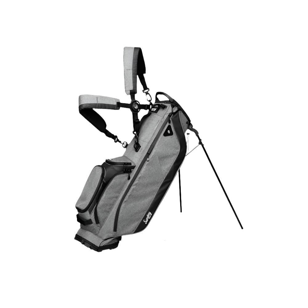 A full-size stand golf bag with multiple pockets, a built-in carry handle, and a backpack-style strap system. The bag is gray with black accents and features the 'Sunday Golf' brand logo.