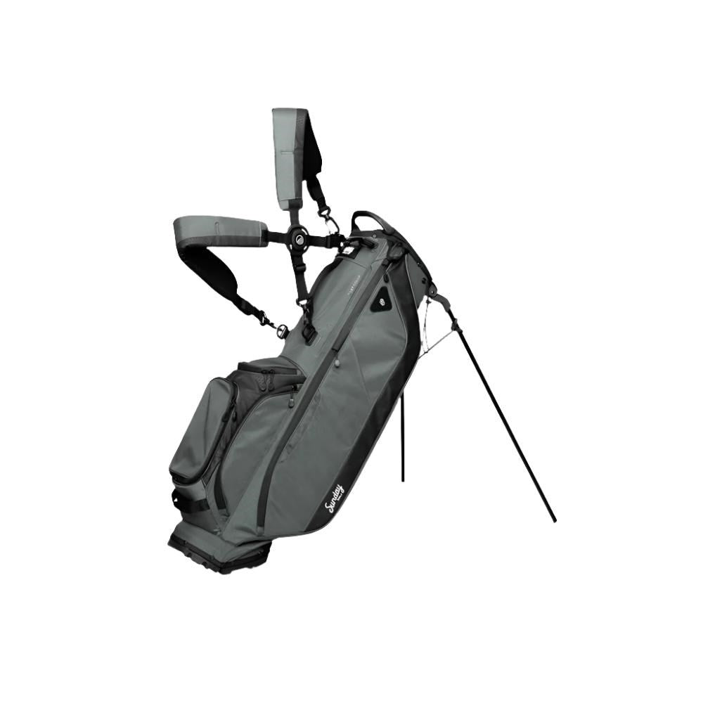 A full-size gray Sunday Golf stand bag with multiple pockets, a built-in carry handle, and a backpack-style strap system.