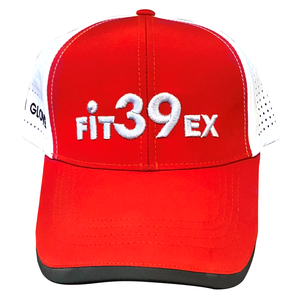 A red and white Fit39 golf cap with an adjustable Velcro strap and airholes on the sides.