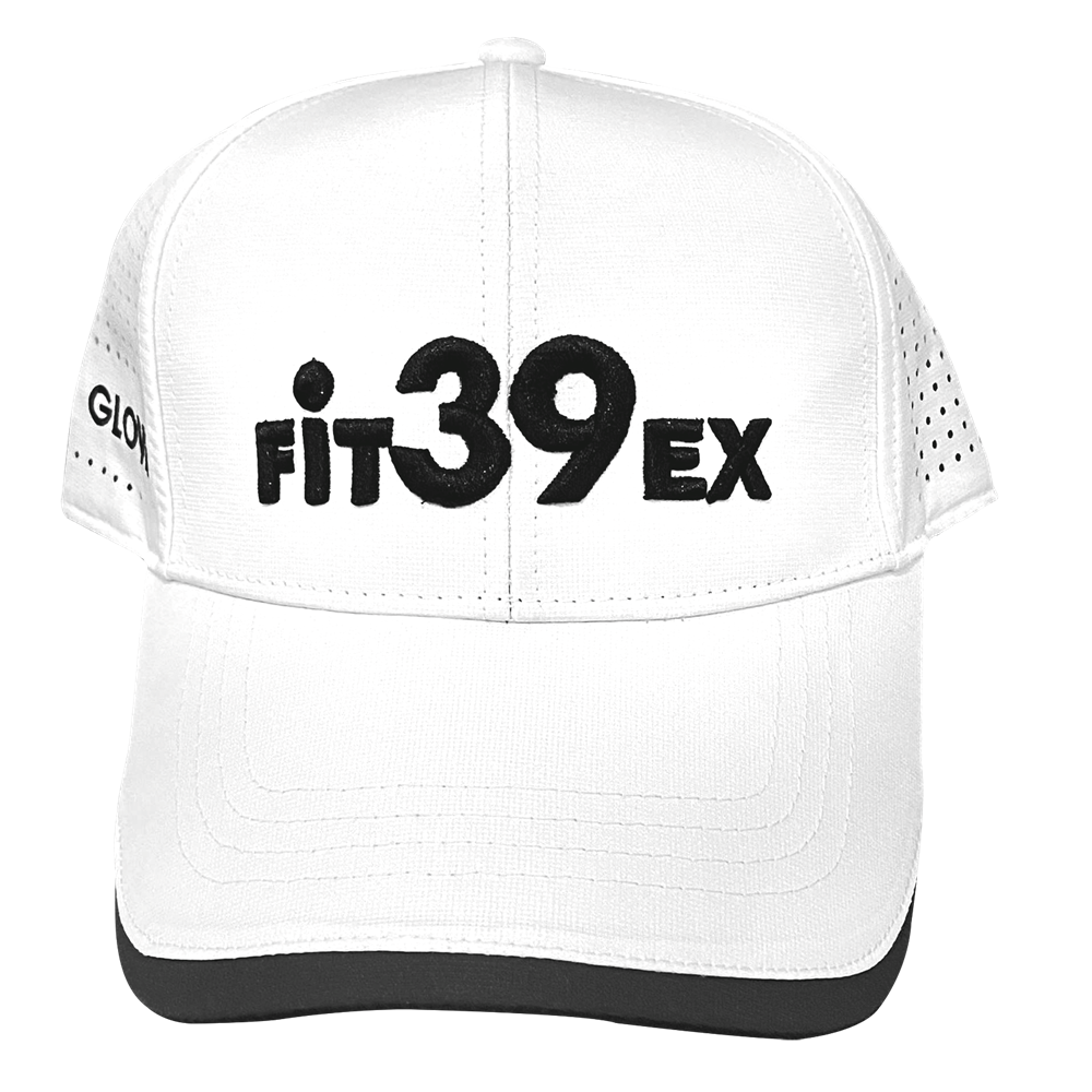 A white golf cap with the Fit39 logo embroidered in black, featuring airholes on the sides and an adjustable Velcro strap at the back.