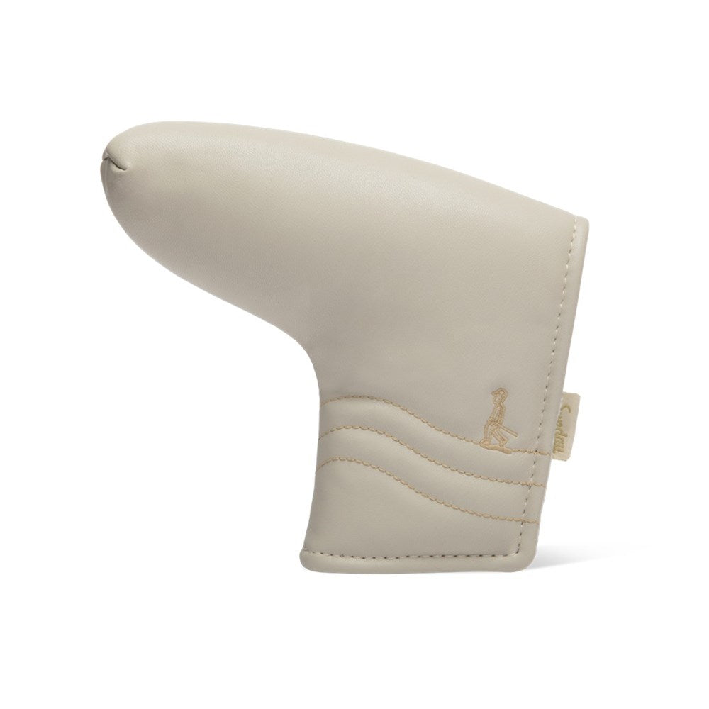 A beige vegan leather golf putter headcover with a magnetic closure.