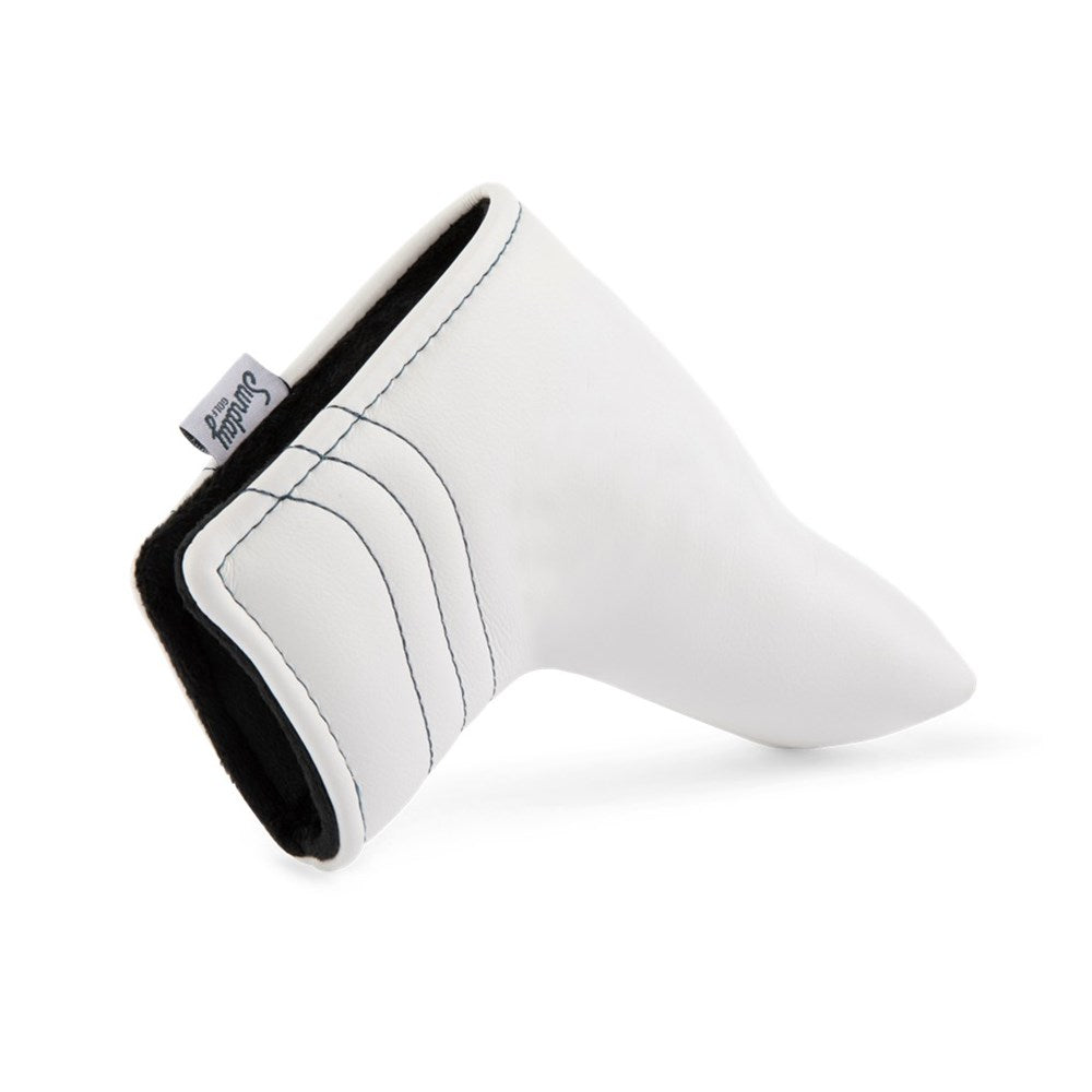 A white and navy vegan leather putter headcover with a magnetic closure, displayed against a white background.