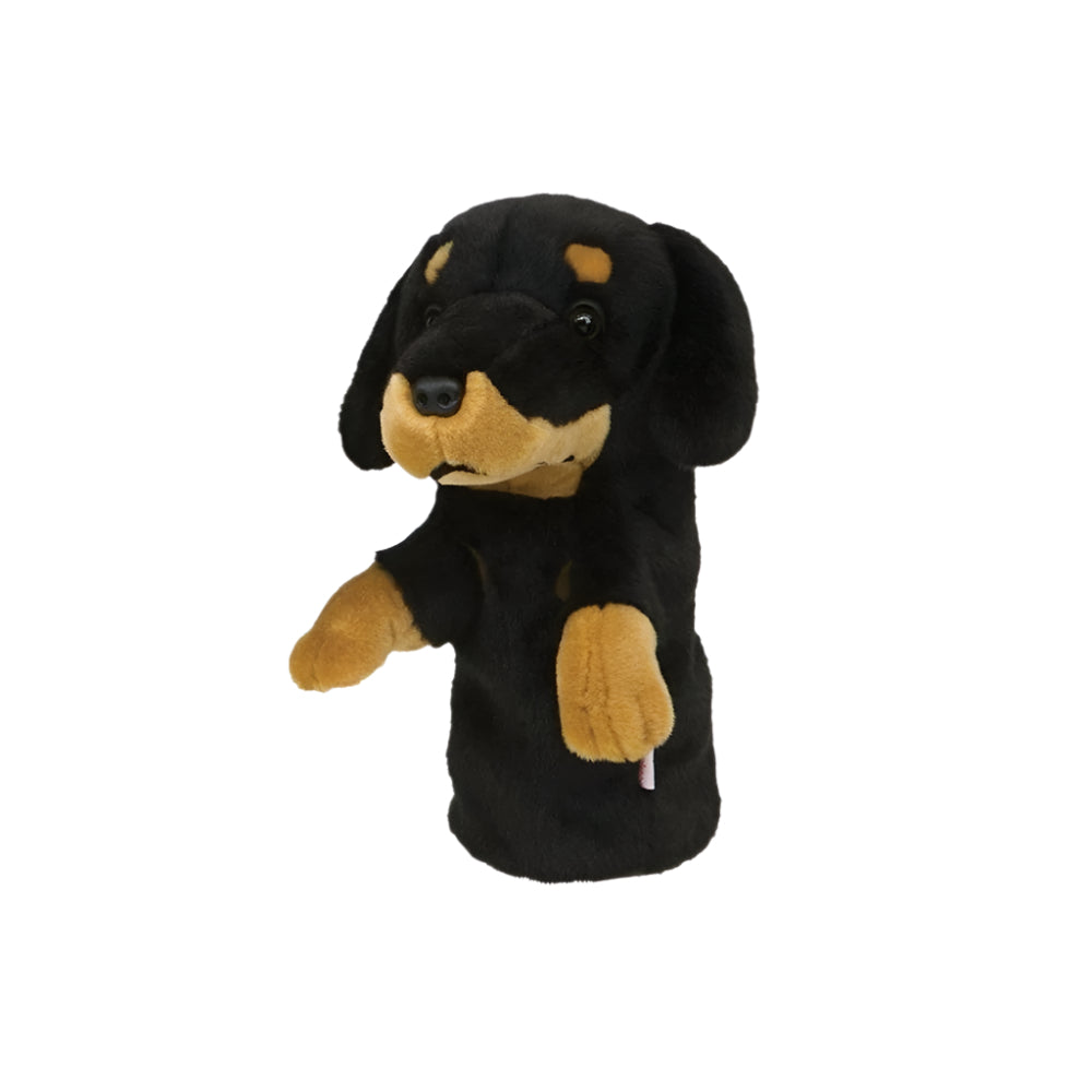 A synthetic black and brown golf club headcover designed to resemble a dog's head.