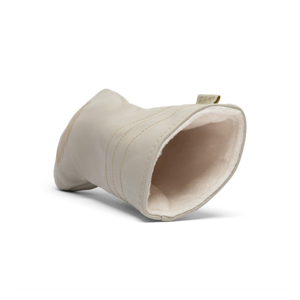 A beige fairway wood golf club headcover made of vegan leather with a sun design.