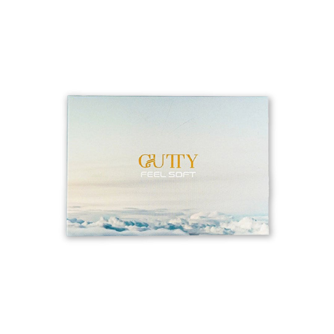 A pack of GUTTY golf balls in white and yellow colors with the brand name and the slogan 'Feel Soft' printed on the packaging against a background image of a cloudy sky.