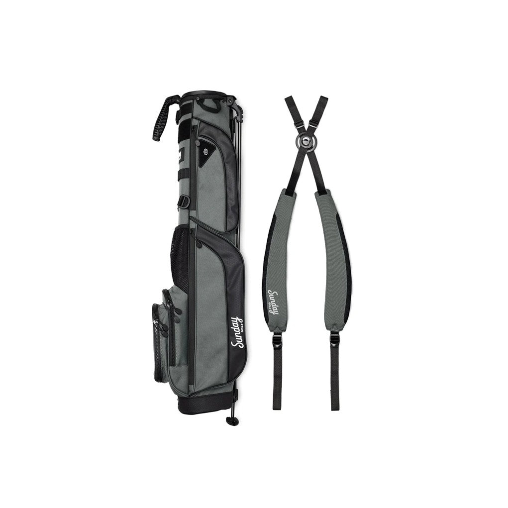 A black golf bag with a stand system, multiple pockets, and branding on the side.