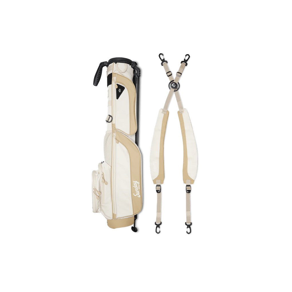 A beige and white golf bag with a stand system deployed, featuring multiple pockets and a logo on the front. Dismantled straps