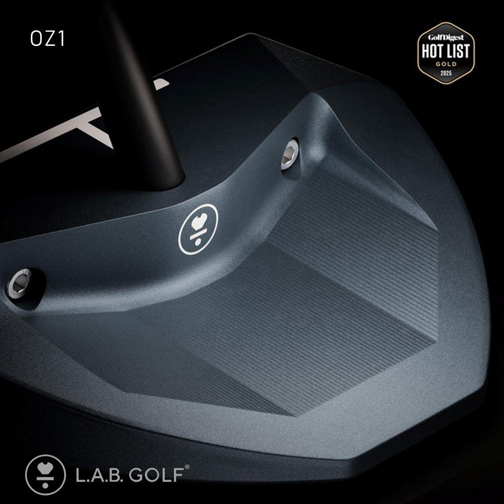 Close-up of a golf club head with L.A.B. Golf branding on a black background