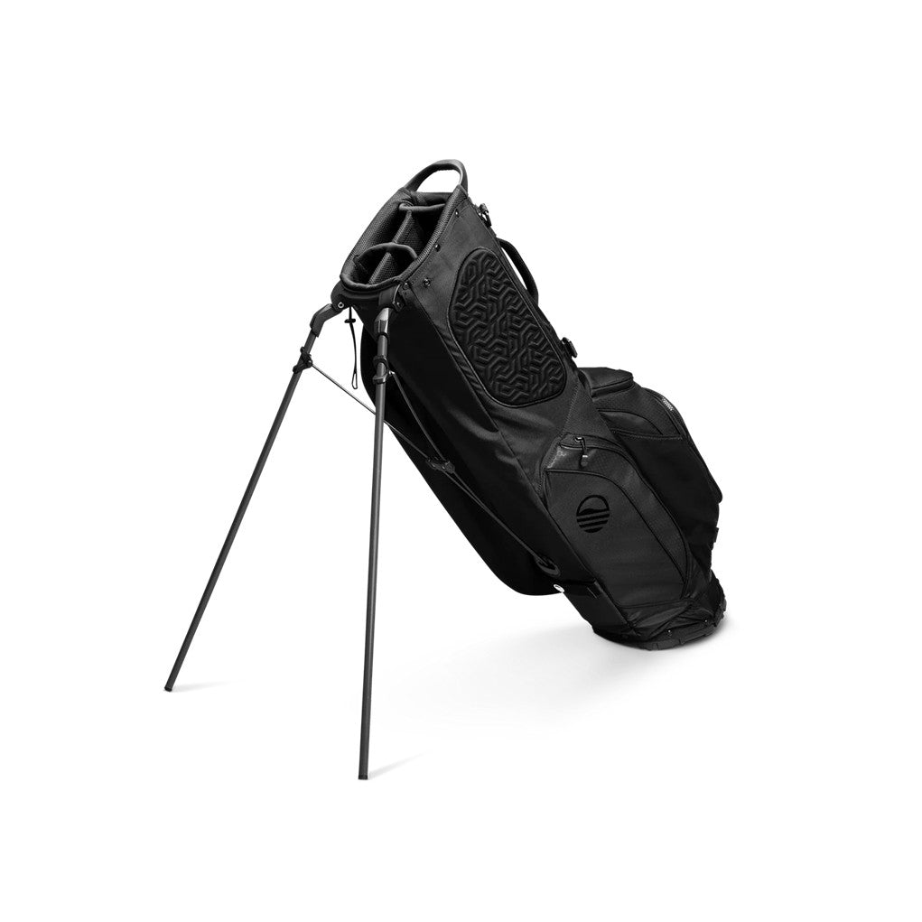 A full-size black golf stand bag with multiple pockets, a backpack-style strap, and a built-in carry handle unfolded.