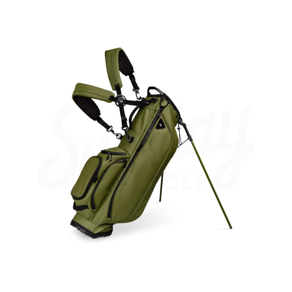 A green Sunday Golf Ryder S-Class golf bag with backpack style strap system, standing on a flat surface.