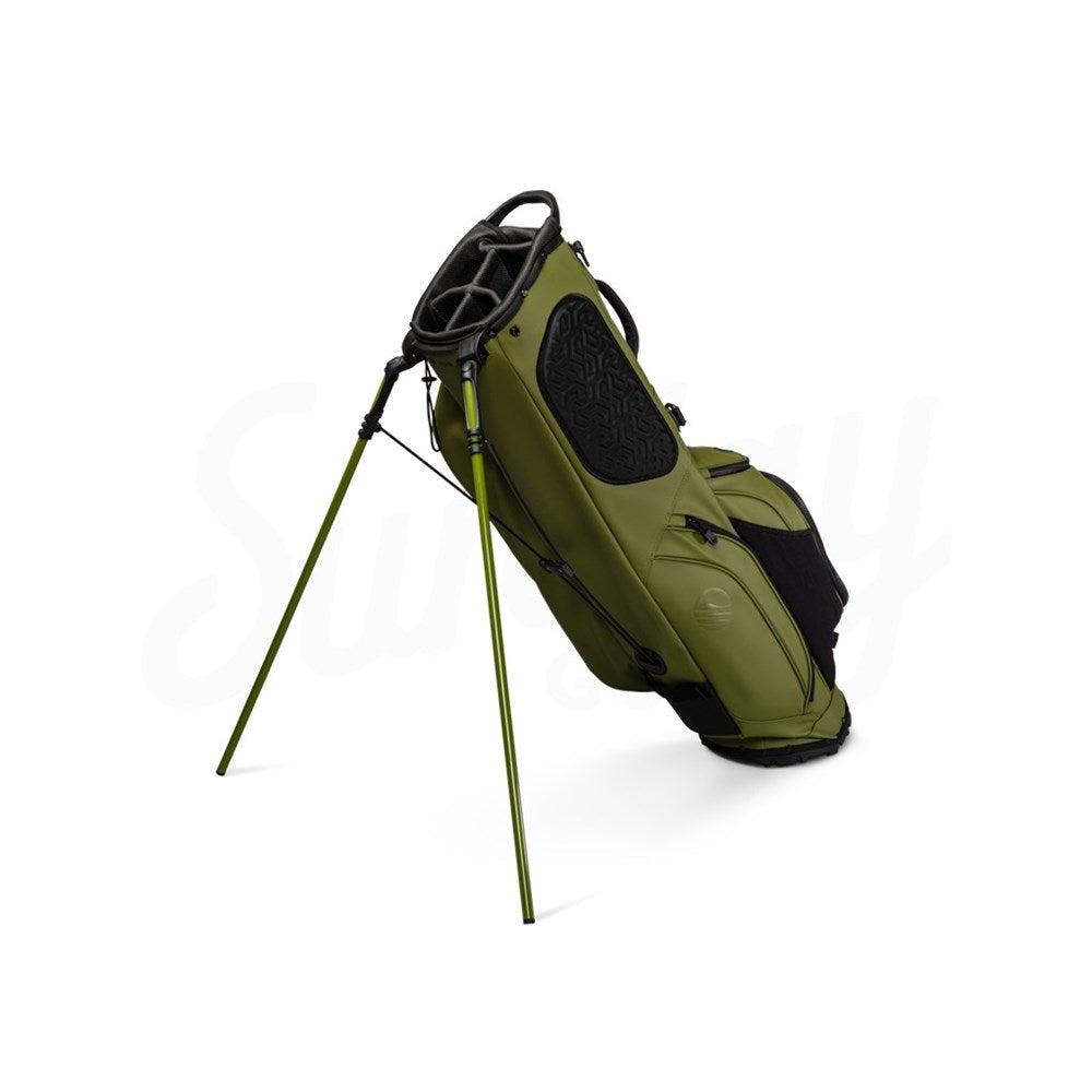 A green Sunday Golf Ryder S-Class golf bag with backpack style strap system, standing on a flat surface.