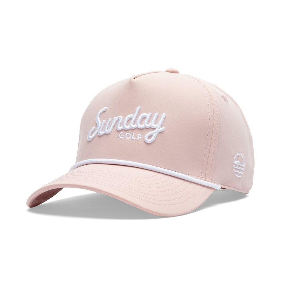 A pink golf hat with 'Sunday Golf' text embroidered on the front and a white rope detail.