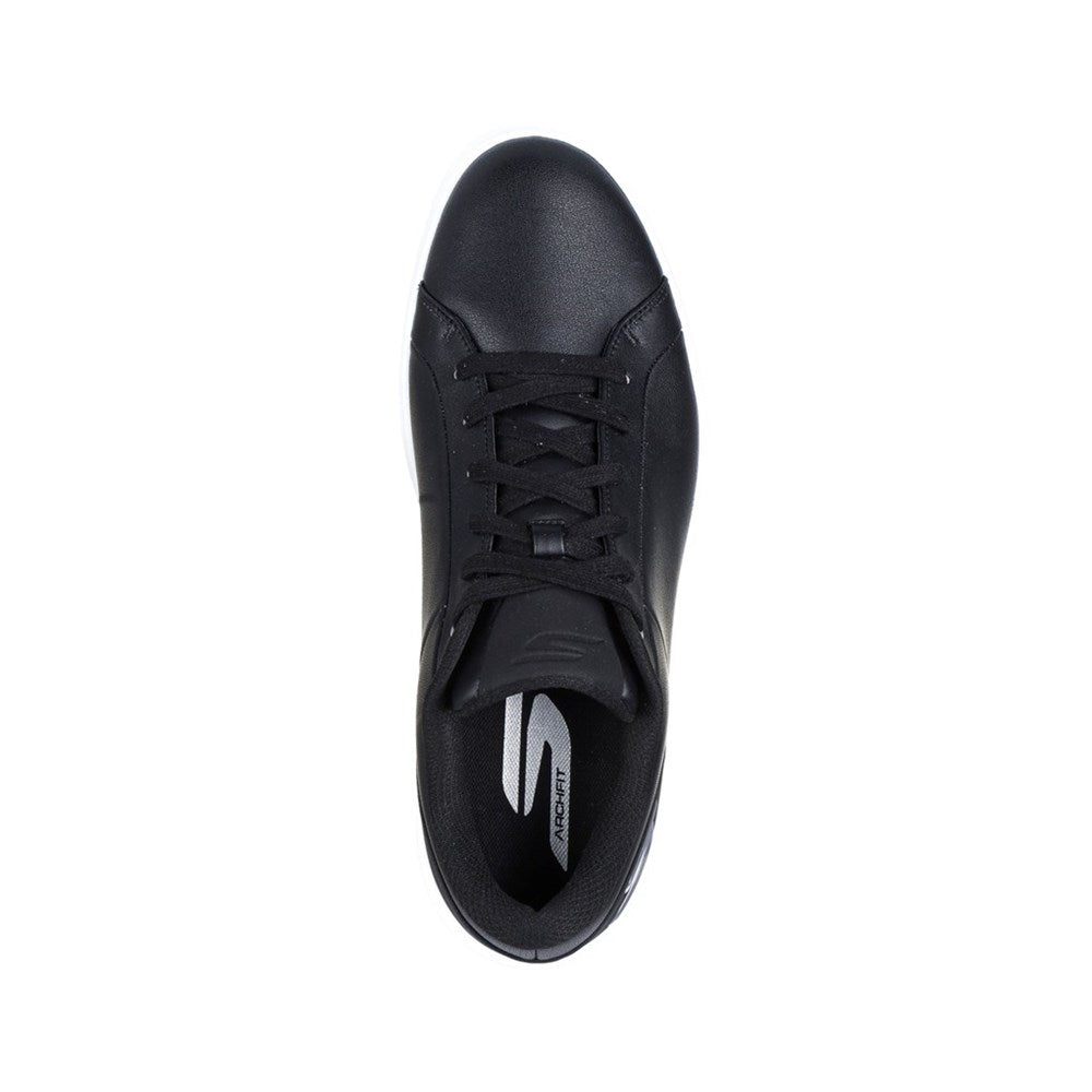 A black Skechers GO GOLF Drive 6 spikeless golf shoe with a white sole, featuring a lace-up front and the Skechers logo on the side. Top view