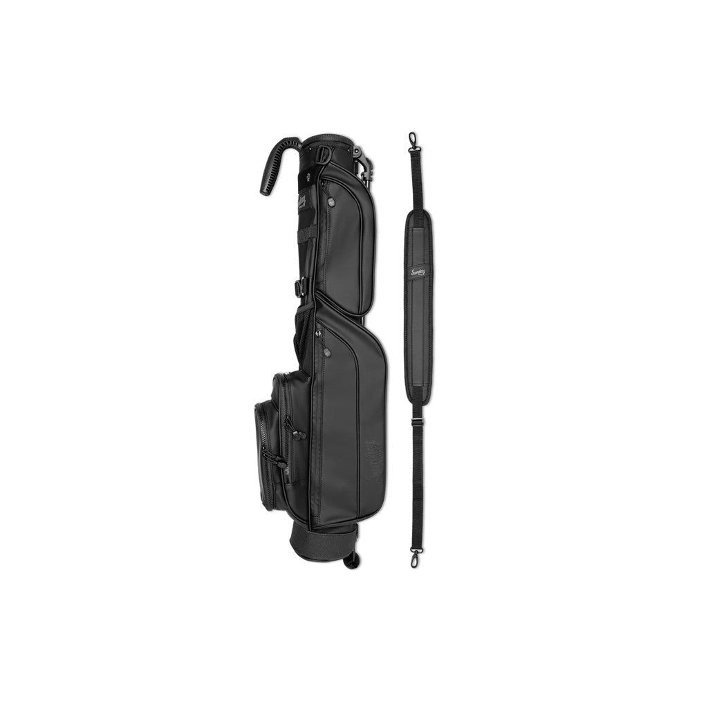 A black golf bag with a stand mechanism, featuring multiple pockets and a shoulder strap.