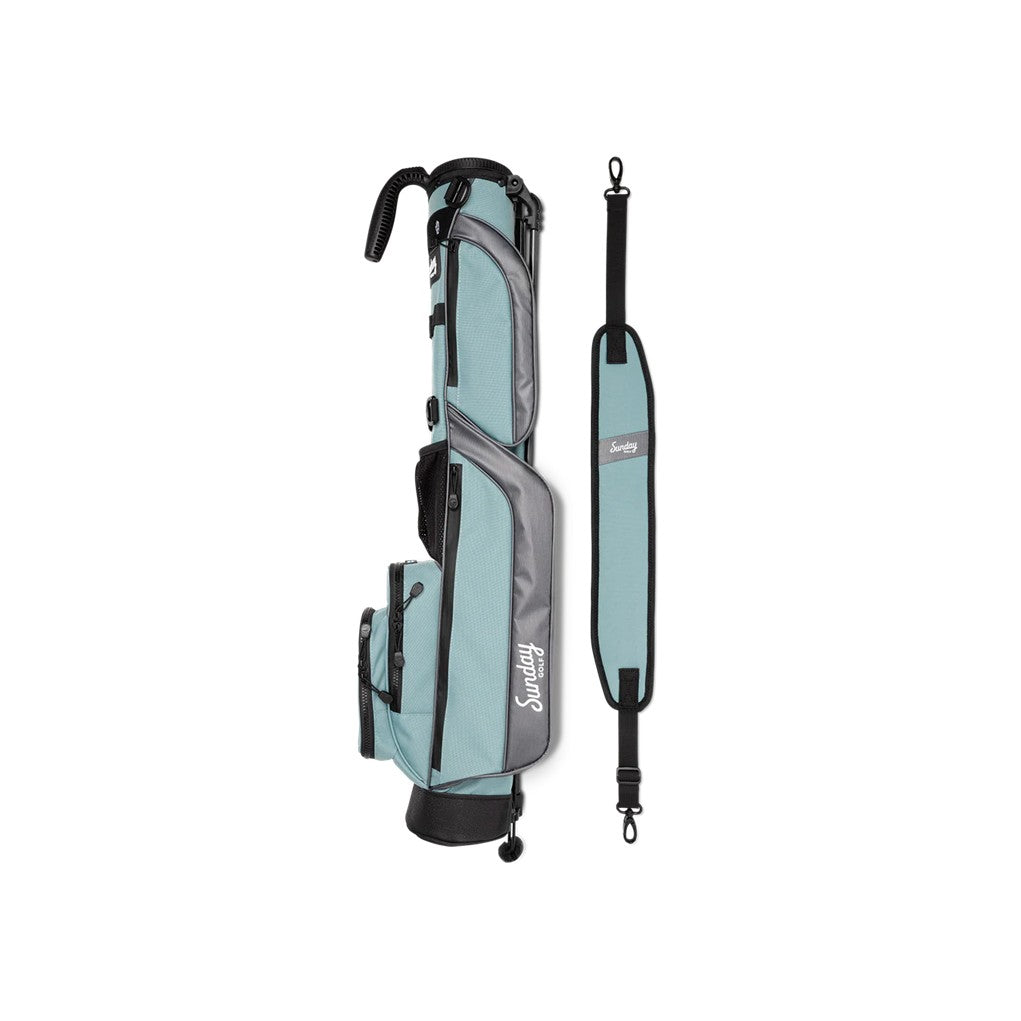 A blue and black golf bag with a stand mechanism deployed, set against a white background.