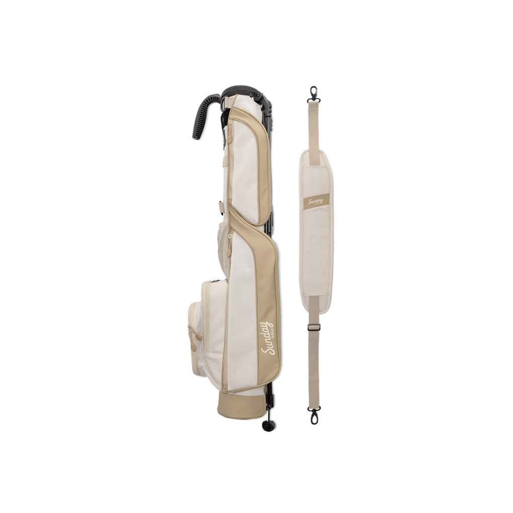 A beige golf bag with a stand, featuring multiple pockets and a shoulder strap.