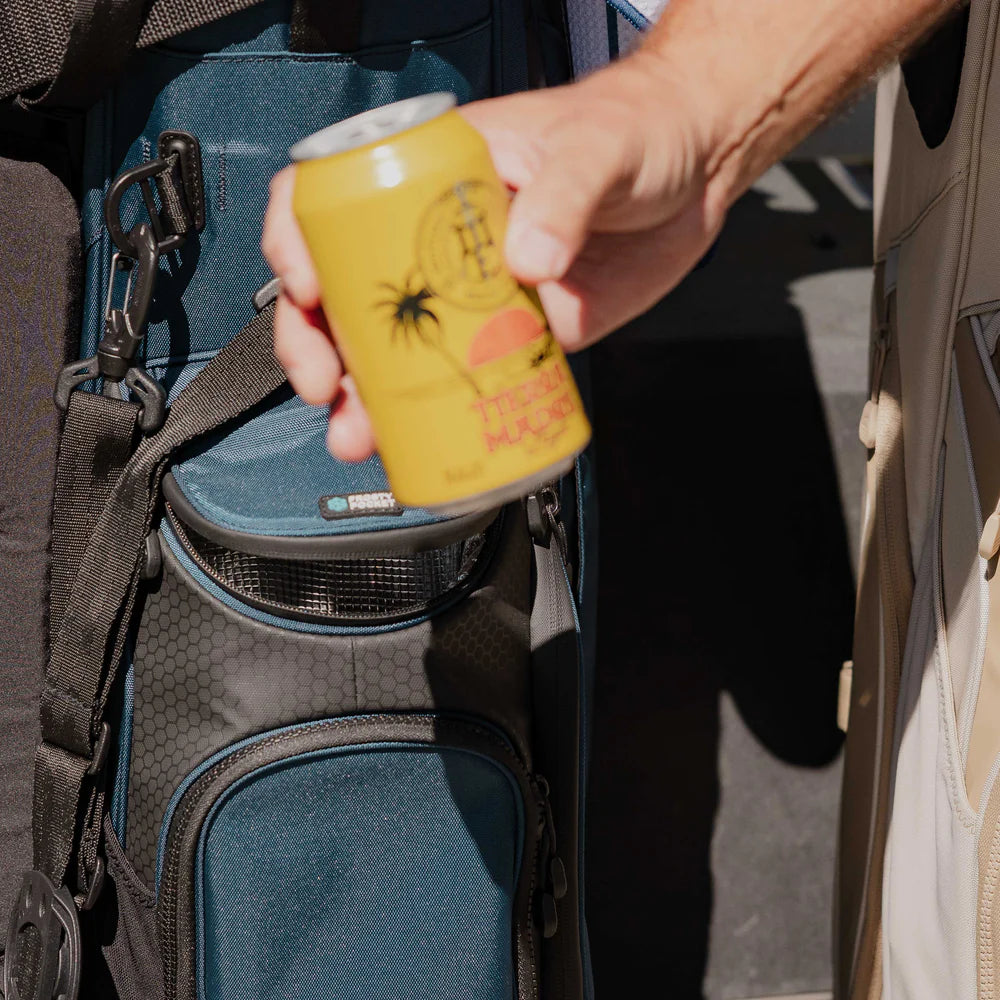 A full-size blue and black Sunday Golf stand bag with multiple pockets, a built-in carry handle, and backpack-style strap system. Model usage