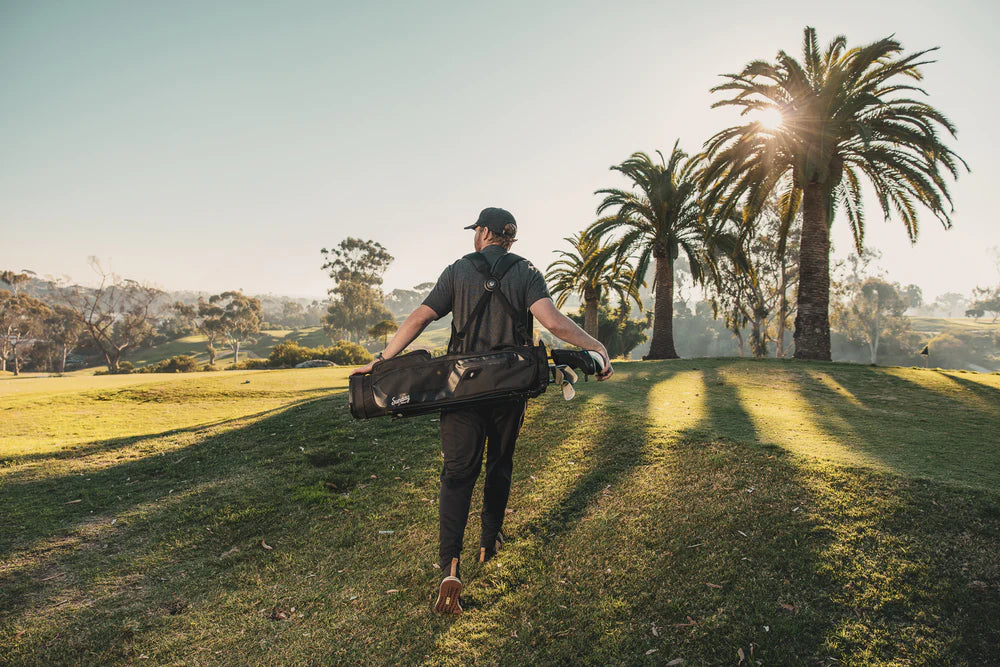 A black golf stand bag with multiple pockets and a dual-strap 4-way top divider, designed for holding up to 10 clubs out on the field.