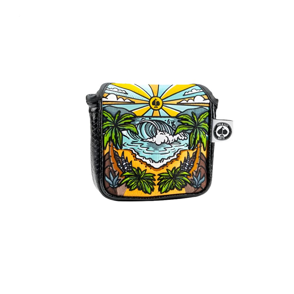 A colorful putter mallet headcover with a vibrant beach and palm tree design, featuring a magnetic closure.
