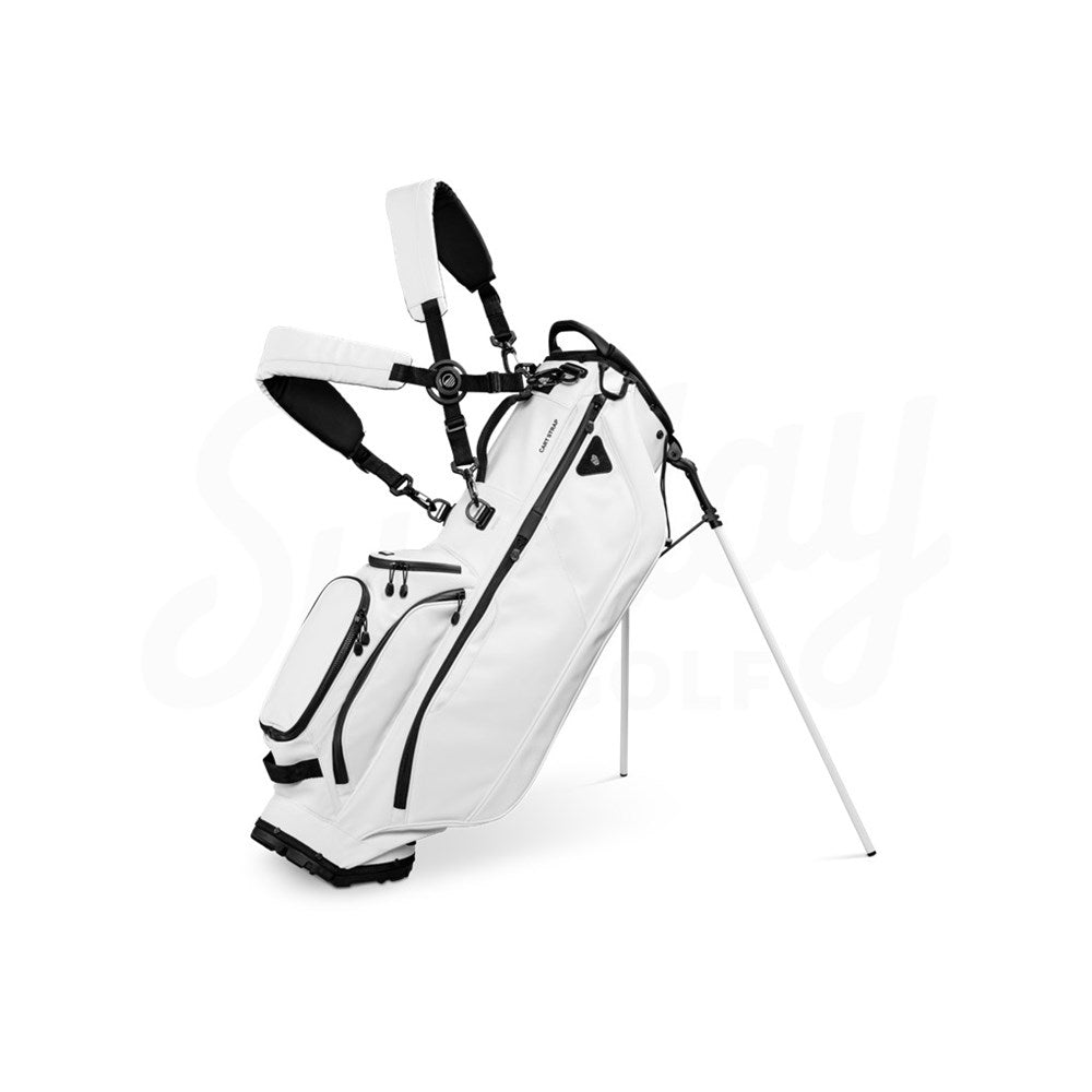 A white Sunday Golf stand bag made of vegan leather, featuring multiple pockets and a full-length divider, displayed on a stand.